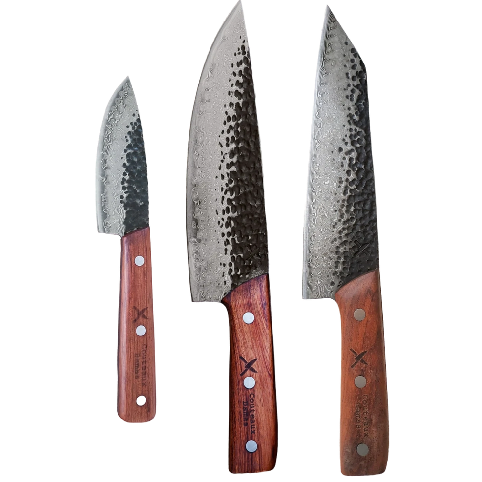 Three Damascus knives with wooden handles on a black background.